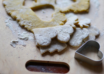 the dough for the shortbread in a heart shape on cutting Board
