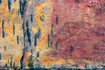 Naklejka premium Texture of a concrete wall with cracks and scratches which can be used as a background