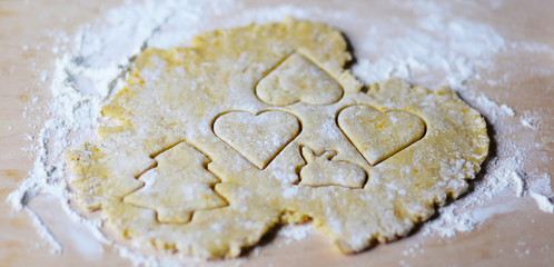the dough for the shortbread in a heart shape on cutting Board
