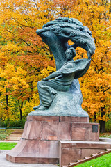 WARSAW, POLAND - OCTOBER 26, 2016: Fryderyk Chopin monument in autumn scenery of the Royal Lazienki...