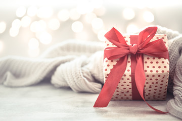 Background holiday, gift in a beautiful box with a red bow .