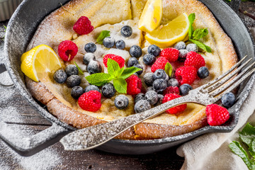 Sweet dutch baby pancake with fruit and berries