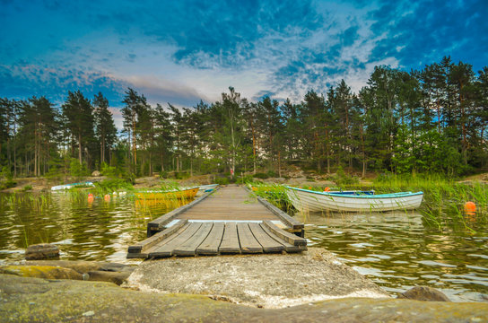  Peaceful cloud landscape on wooden pathway through the lake water and windy water reflection of stadinding cannoe
