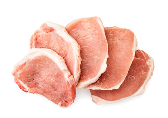 Pieces of raw meat with a layer of fat on a white. The view of the top.