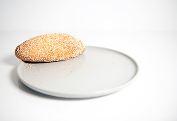 sesame cake on plate isolated on white background