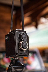 The old Soviet medium format film camera hanging on a belt at a flea market