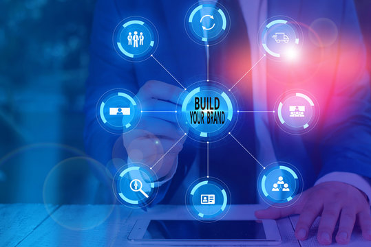 Writing note showing Build Your Brand. Business concept for enhancing brand equity using advertising campaigns Picture photo network scheme with modern smart device