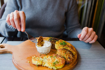 food lunch potato pancakes sour cream