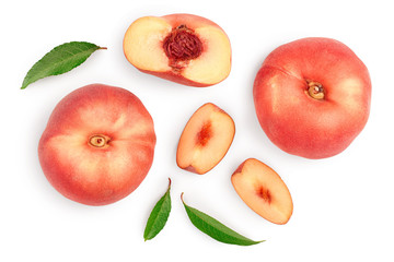 Ripe chinese flat peach fruit and half with leaf isolated on white background. Top view. Flat lay