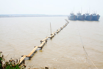 Fishing boats and bridge