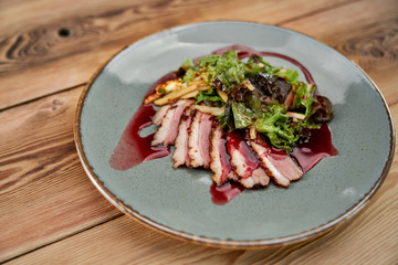 Lard with horseradish and cranberry sauce.