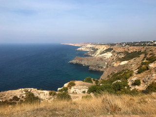 Beautiful view of the Black Sea at Cape Fiolent in Sevastopol. Blue-green sea and mountains in Crimea