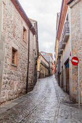 Fototapeta na wymiar Narrow street in the old town of Avila, Spain.