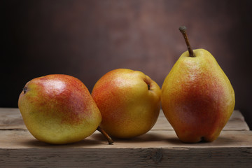 Three pears on old table