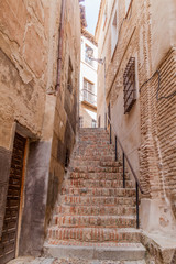 Fototapeta na wymiar Narrow stairway in the old town of Toledo, Spain