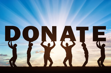 Altruism. Group of men holds letters Donate