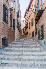 Fototapeta na wymiar Narrow alley in Toledo, Spain