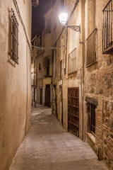 Fototapeta na wymiar Narrow street in the old town of Toledo, Spain