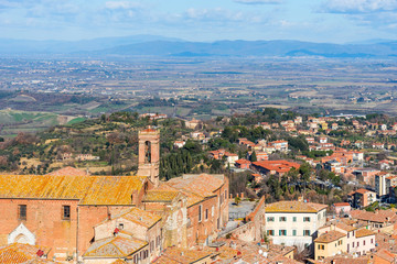 Fototapeta na wymiar Picturesque aerial view of the medieval town Montepulciano in Tuscany, Italy. Aerial view of the historical centre in winter.