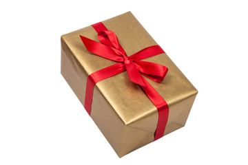 Goldenes Weihnachtsgeschenk mit roter Schleife als Freisteller