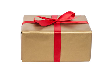 Goldenes Weihnachtsgeschenk mit roter Schleife als Freisteller