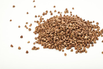 handful of buckwheat on a white table