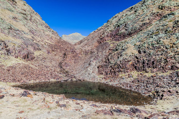 Small lake in Parc Natural Comunal de les Valls del Comapedrosa national park in Andorra