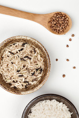 white rice, buckwheat and brown rice in plates