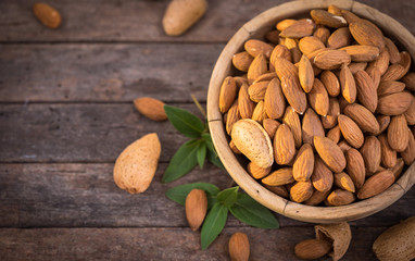 Fresh almonds in the wooden bowl