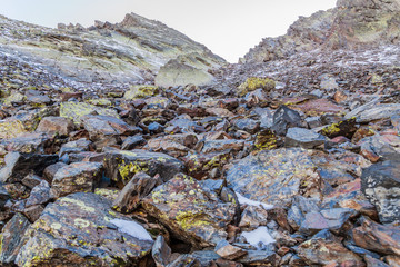 Rocks and snow at the slopes of Coma Pedrosa, highest mountain in Andorra