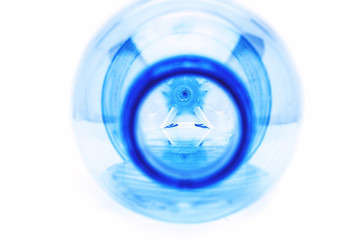 Lying Open Plastic Bottle with Leftover Water, Visible Bottom and Reflections. Global Warming,...