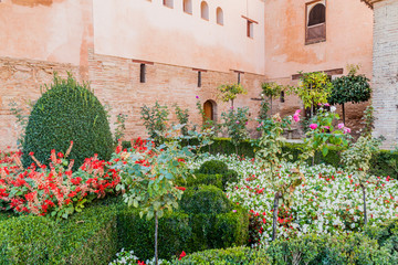 Fototapeta na wymiar Small garden at Nasrid Palaces (Palacios Nazaries) at Alhambra in Granada, Spain