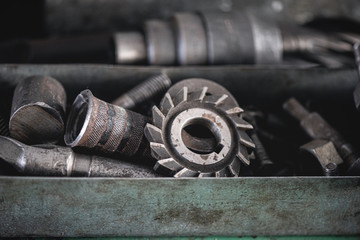 Old machinery details in a metal box. Industry abstract background.