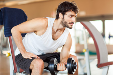 Man lifting weight at the gym