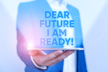 Writing note showing Dear Future I Am Ready. Business concept for Confident to move ahead or to face the future Man in the blue suite and white shirt holds mobile phone in the hand