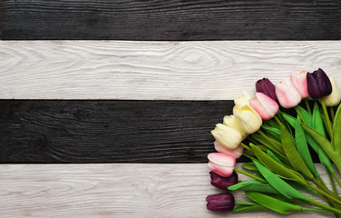  flowers on a dark, black and white wooden textured background
