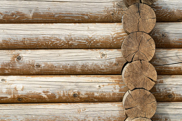 log wall. light wooden wall. environmentally friendly house. wooden blockhouse. wood fibers. logs. fresh wood wall. log cut. rustic wooden cabin. tree knots. hardwood. copy space. wood texture