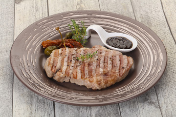 Grilled pork steak with pepper sauce