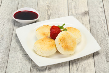 Curd pancakes with jam and stravberry