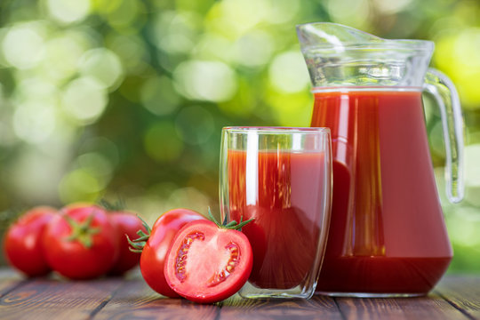 tomato juice in glass and jug