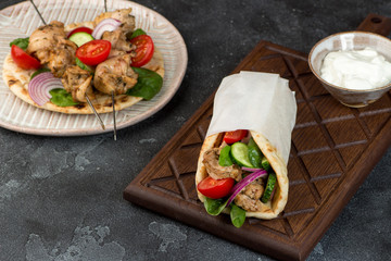 Souvlaki with vegetables wrapped in pita