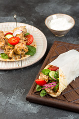Souvlaki with vegetables wrapped in pita