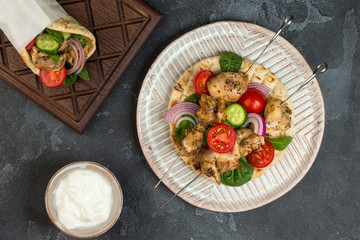 Souvlaki with vegetables wrapped in pita