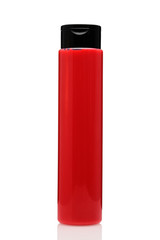 Red tall bottle of shampoo or gel on a white isolated background.