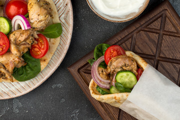 Souvlaki with vegetables wrapped in pita