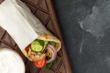 Souvlaki with vegetables wrapped in pita