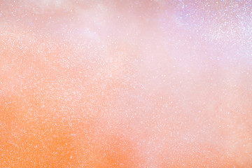 gold paint in water sparkles, sparkling shiny water background.