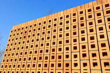 Fototapeta premium Yellow hollow brick wall