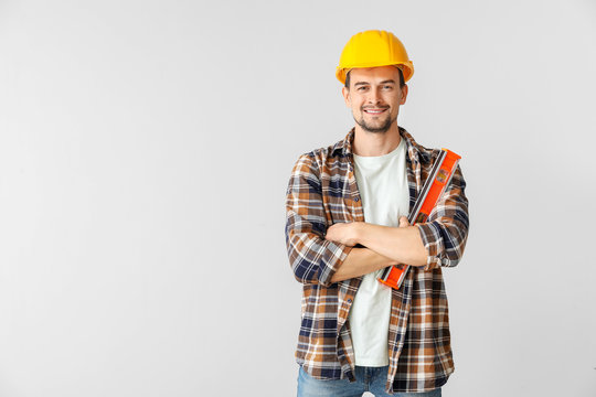 Portrait of male architect on light background
