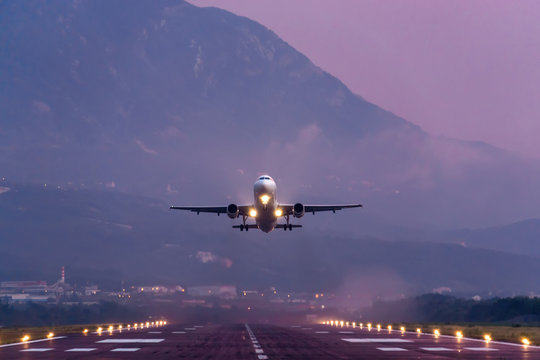 Sunset view of Airport of Tivat, Montenegro, with take-off planes.